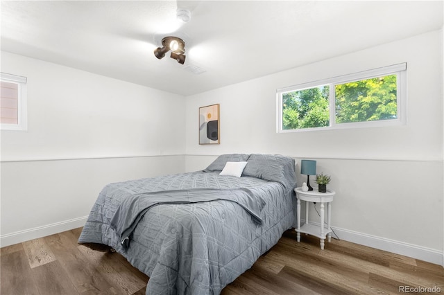 6604 S Dahlia Cir, Centennial, CO 80121 - bedroom with baseboards and wood finished floors