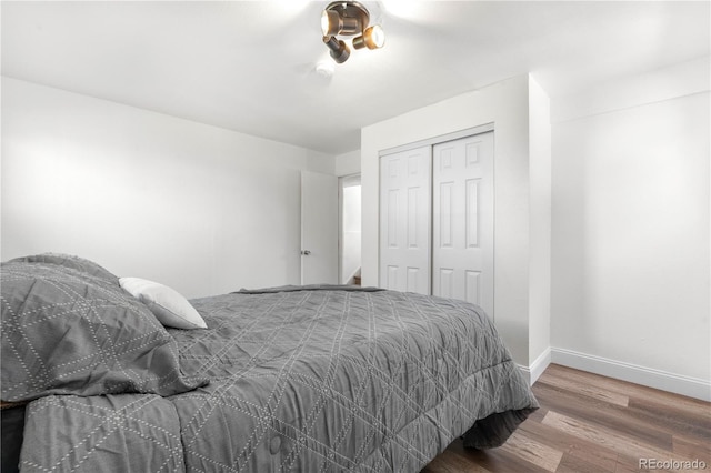 6604 S Dahlia Cir, Centennial, CO 80121 - bedroom with wood finished floors and a closet