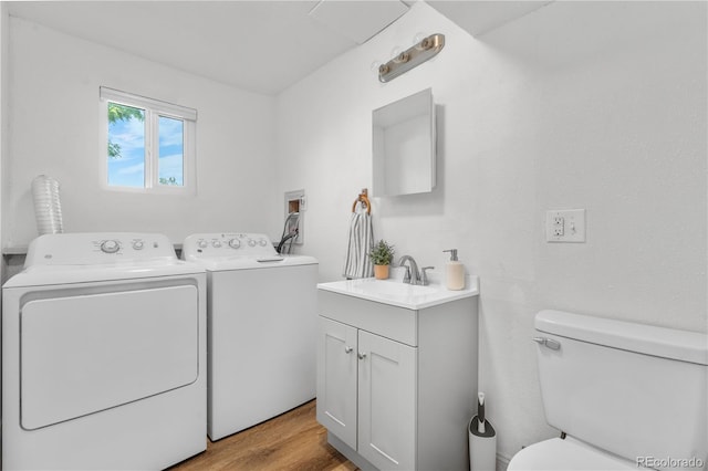 6604 S Dahlia Cir, Centennial, CO 80121 - washroom featuring separate washer and dryer and light wood-style floors