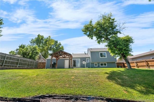 6604 S Dahlia Cir, Centennial, CO 80121 - rear view of property with a fenced backyard and a gazebo