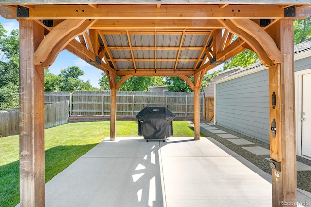 6604 S Dahlia Cir, Centennial, CO 80121 - fenced backyard featuring a patio area and a grill