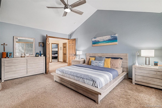 carpeted bedroom with lofted ceiling and ceiling fan