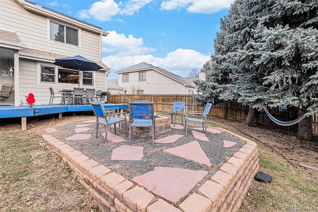 view of patio featuring a deck and a fire pit