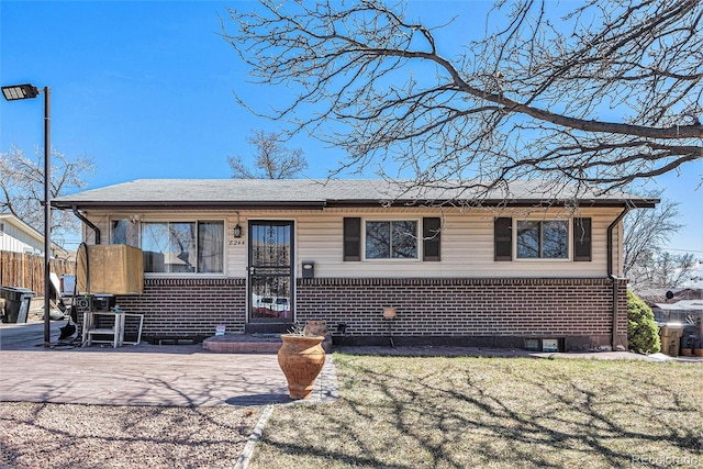 single story home with brick siding and fence
