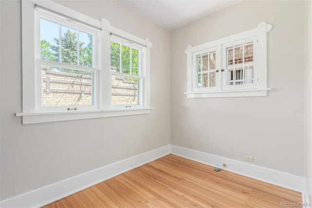 unfurnished room featuring hardwood / wood-style floors