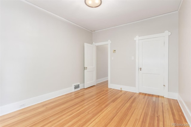 unfurnished room featuring light hardwood / wood-style floors