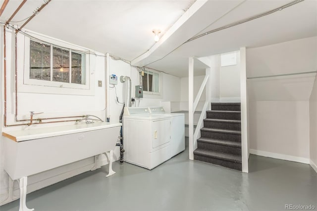 clothes washing area featuring independent washer and dryer