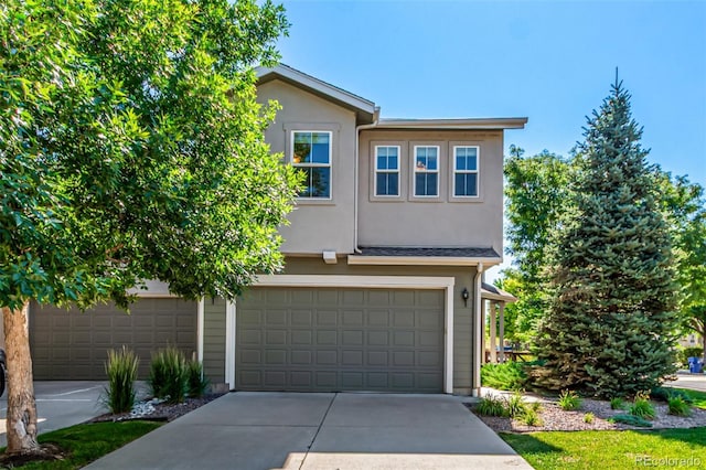 6190 S Oswego St, Englewood, CO 80111 - traditional-style home featuring concrete driveway, stucco siding, and a garage