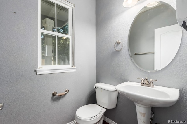 6190 S Oswego St, Englewood, CO 80111 - bathroom featuring toilet and baseboards