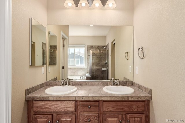 6190 S Oswego St, Englewood, CO 80111 - bathroom with a stall shower, double vanity, and a bath