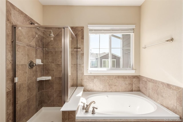 6190 S Oswego St, Englewood, CO 80111 - bathroom featuring plenty of natural light, a shower stall, and a tub with jets