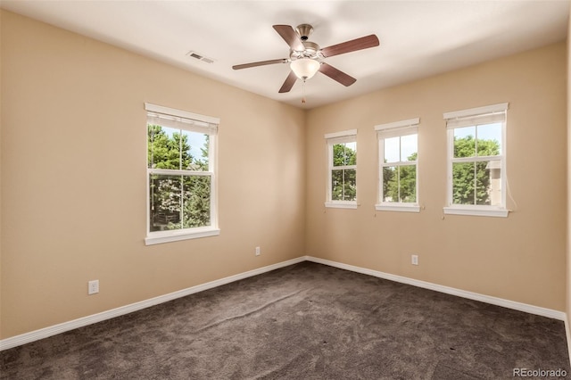 6190 S Oswego St, Englewood, CO 80111 - empty room with dark colored carpet and a ceiling fan