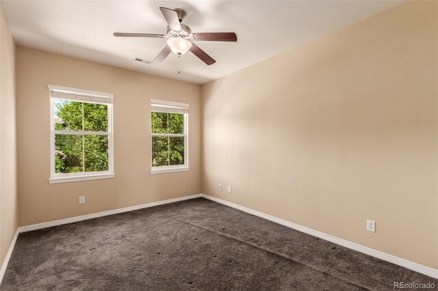 6190 S Oswego St, Englewood, CO 80111 - spare room featuring dark carpet and ceiling fan