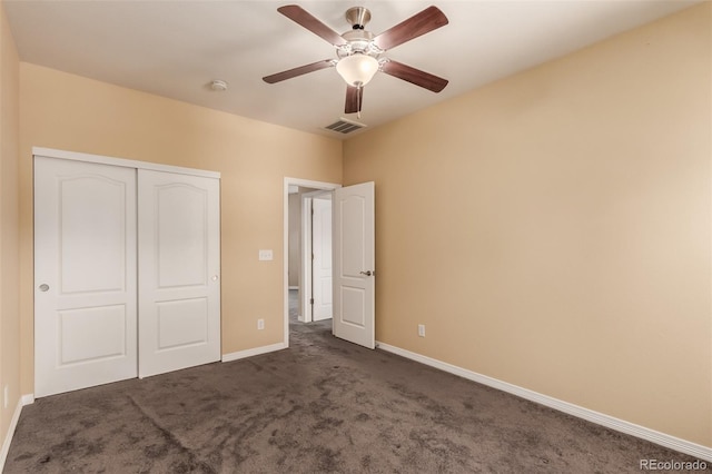 6190 S Oswego St, Englewood, CO 80111 - unfurnished bedroom with dark carpet, a closet, and a ceiling fan