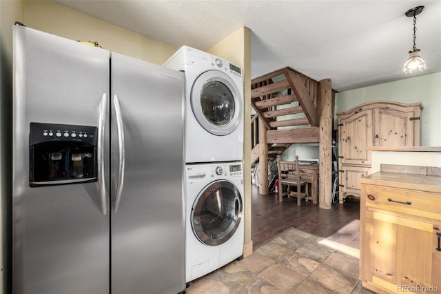 laundry area featuring stacked washer and dryer