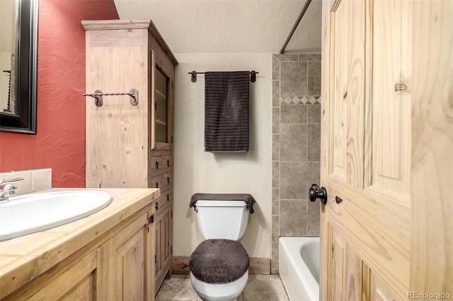 full bathroom with toilet, tiled shower / bath combo, and vanity