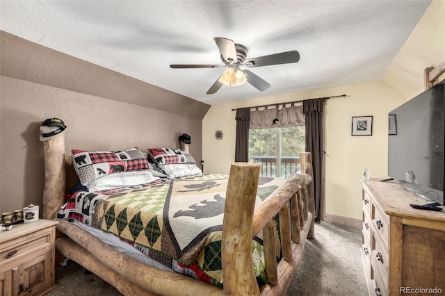 bedroom featuring ceiling fan, lofted ceiling, dark carpet, and access to outside