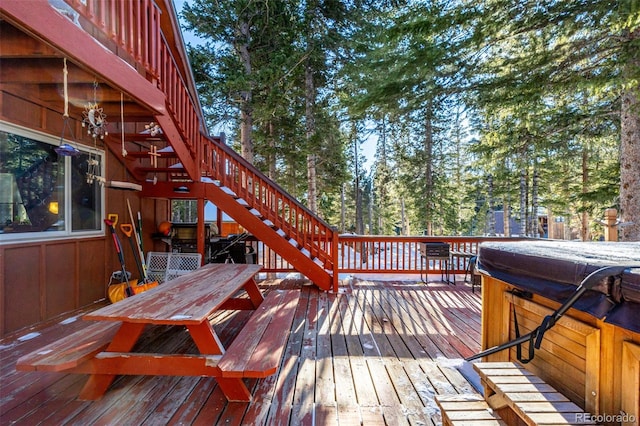 wooden terrace with a hot tub