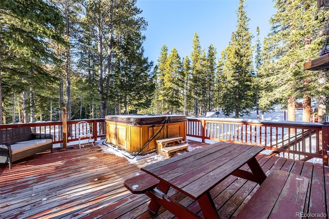 deck with a hot tub