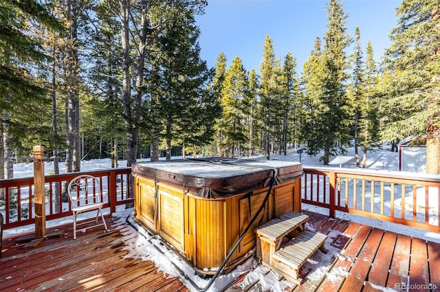 wooden deck with a hot tub