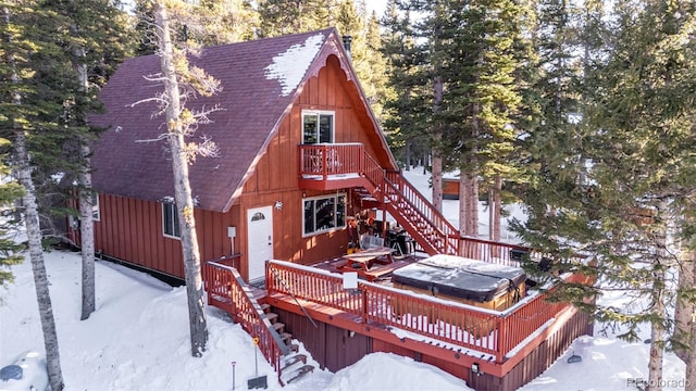 view of front facade with a deck and a hot tub