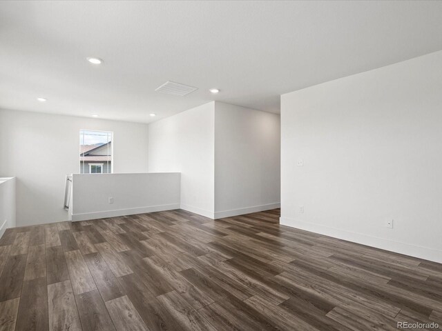 17843 W 93rd Pl, Arvada, CO 80007 - empty room with dark wood-type flooring and recessed lighting
