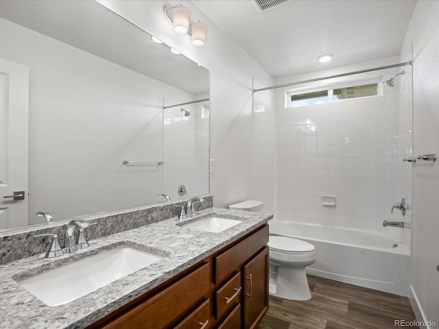 17843 W 93rd Pl, Arvada, CO 80007 - bathroom with wood finished floors,  shower combination, and double vanity
