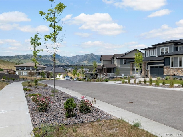 17843 W 93rd Pl, Arvada, CO 80007 - view of asphalt road with a residential view and a mountain view