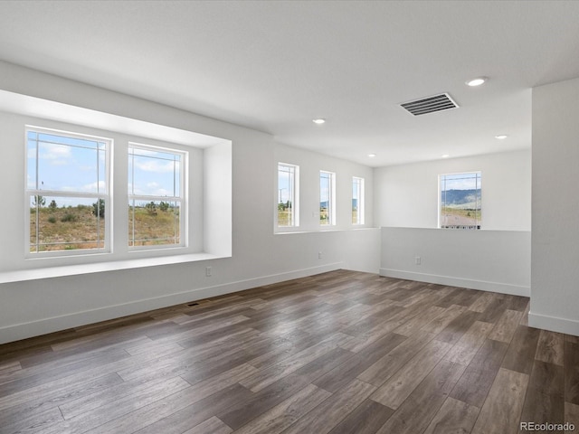 17843 W 93rd Pl, Arvada, CO 80007 - spare room with wood finished floors and recessed lighting
