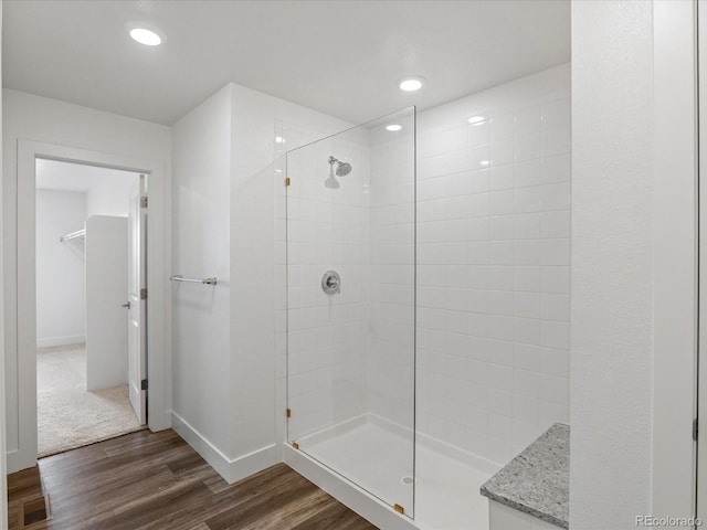 17843 W 93rd Pl, Arvada, CO 80007 - bathroom with a walk in shower, wood finished floors, and recessed lighting