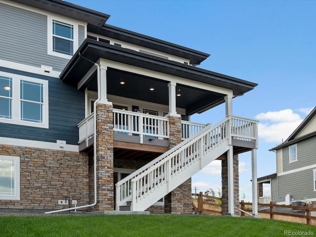 17843 W 93rd Pl, Arvada, CO 80007 - view of home's exterior with stone siding and stairway