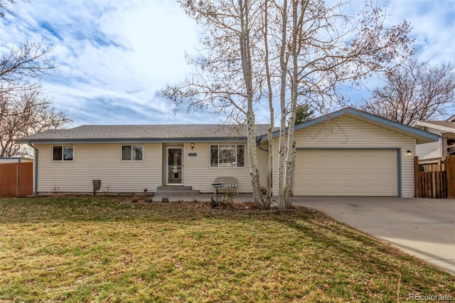 ranch-style home with a front yard and a garage