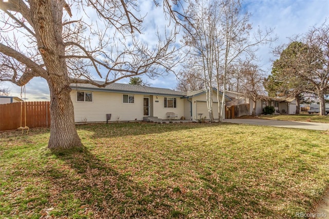 single story home with a garage and a front lawn