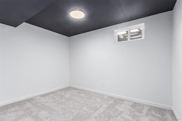 empty room featuring light carpet