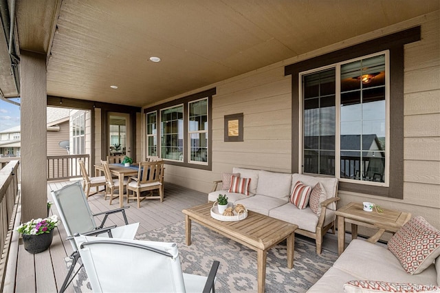 wooden deck featuring an outdoor living space