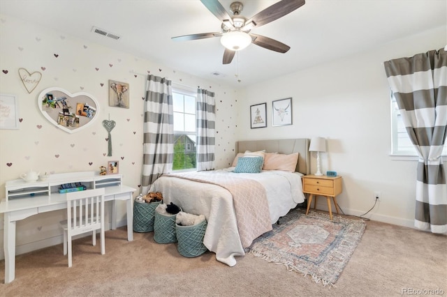 bedroom featuring light colored carpet and ceiling fan