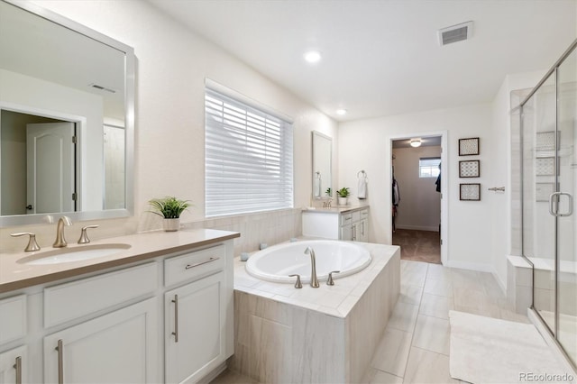 bathroom with separate shower and tub, tile patterned floors, and vanity