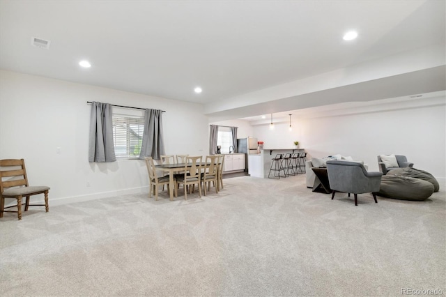 dining space with light carpet