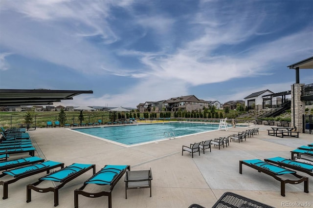 view of swimming pool with a patio