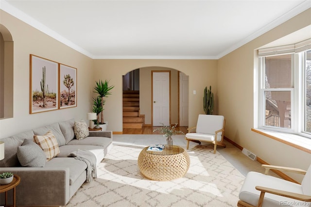 3765 S Depew St, Denver, CO 80235 - living area with stairway, ornamental molding, arched walkways, and visible vents