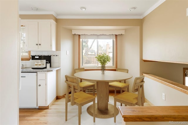 3765 S Depew St, Denver, CO 80235 - dining area with light wood finished floors and crown molding