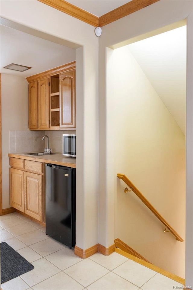 3765 S Depew St, Denver, CO 80235 - kitchen with light tile patterned floors, light countertops, open shelves, and a sink