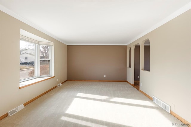 3765 S Depew St, Denver, CO 80235 - carpeted spare room featuring crown molding, visible vents, and baseboards