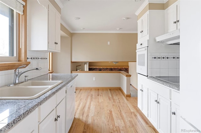 3765 S Depew St, Denver, CO 80235 - kitchen with ornamental molding, white appliances, a sink, ventilation hood, and tasteful backsplash