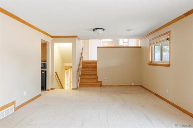 3765 S Depew St, Denver, CO 80235 - interior space with light colored carpet, visible vents, and ornamental molding