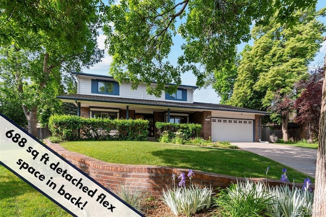 1998 S Harlan Ct, Lakewood, CO 80227 - traditional-style house with concrete driveway, a garage, and brick siding