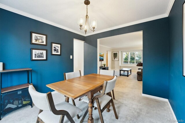 1998 S Harlan Ct, Lakewood, CO 80227 - carpeted dining area with a chandelier, crown molding, and baseboards