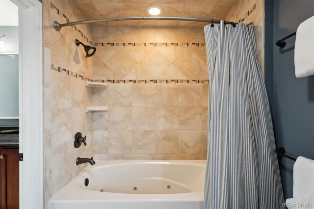 1998 S Harlan Ct, Lakewood, CO 80227 - bathroom featuring a combined bath / shower with jetted tub