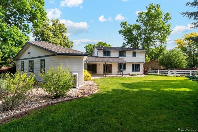 1998 S Harlan Ct, Lakewood, CO 80227 - rear view of house featuring a patio