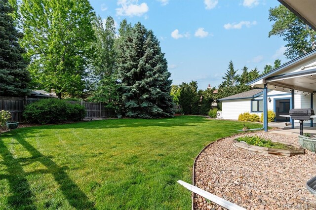 1998 S Harlan Ct, Lakewood, CO 80227 - view of yard featuring a patio area